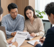 Family tax residency consultation with legal documents in a modern law office