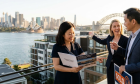 Sydney Opera House and harbor with real estate documents
